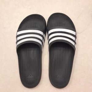 Black adidas slides